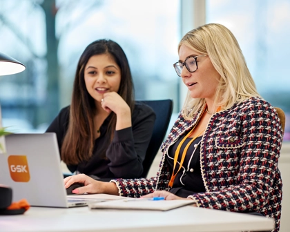 two female employees working in the office