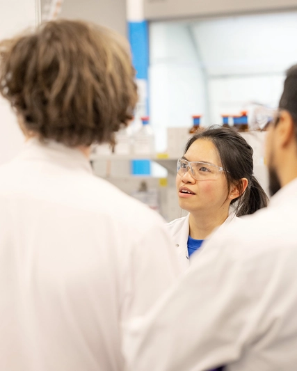 Scientists in a lab having a discussion