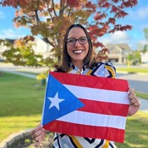 Smiling woman with Puerto Rican flag